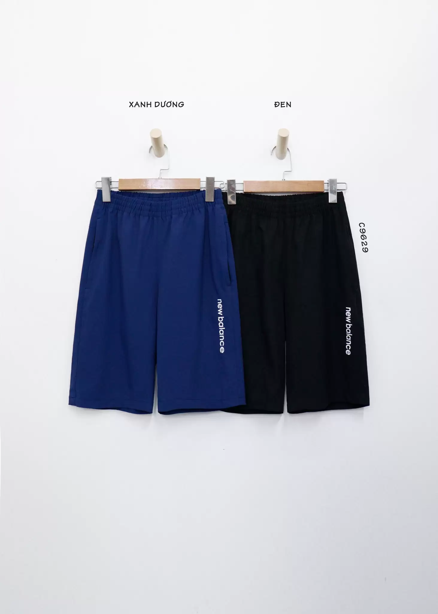 Quần short dù nam NB túi xéo in chữ dọc