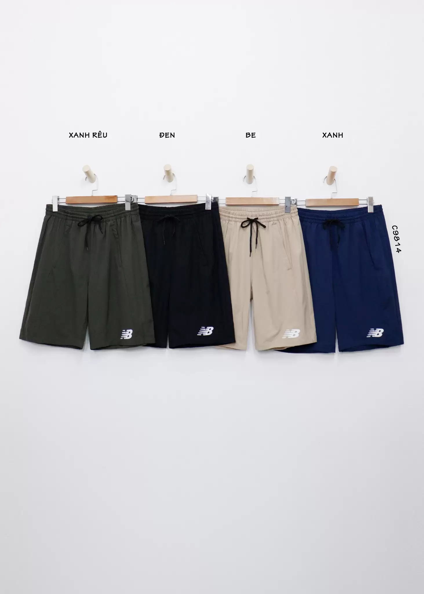 Quần short dù nam NB phối 2 túi xéo in NB